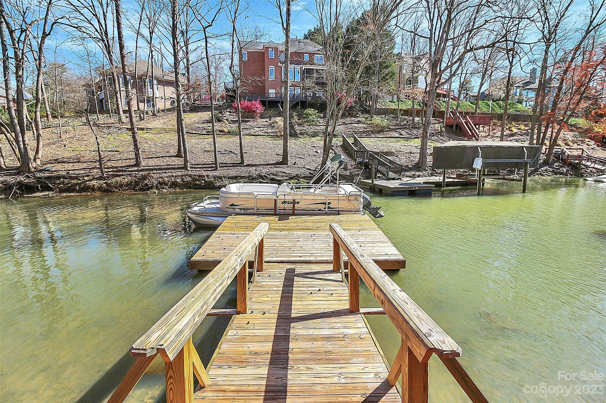 7022 Chelsea Day Lane Tega Cay, SC 29708 - Photo 37 of 48 a view of a lake with large trees