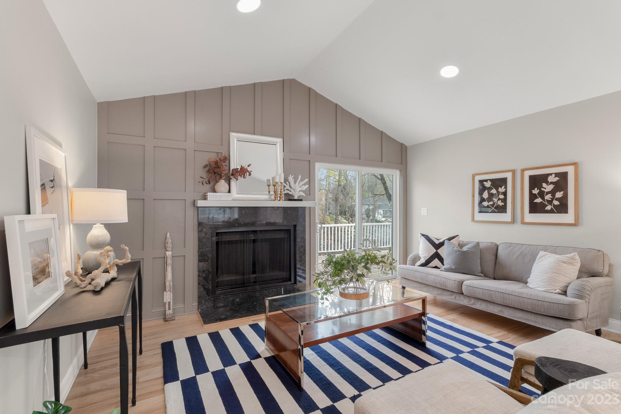 7022 Chelsea Day Lane Tega Cay, SC 29708 - Photo 5 of 48 a living room with furniture and a fireplace