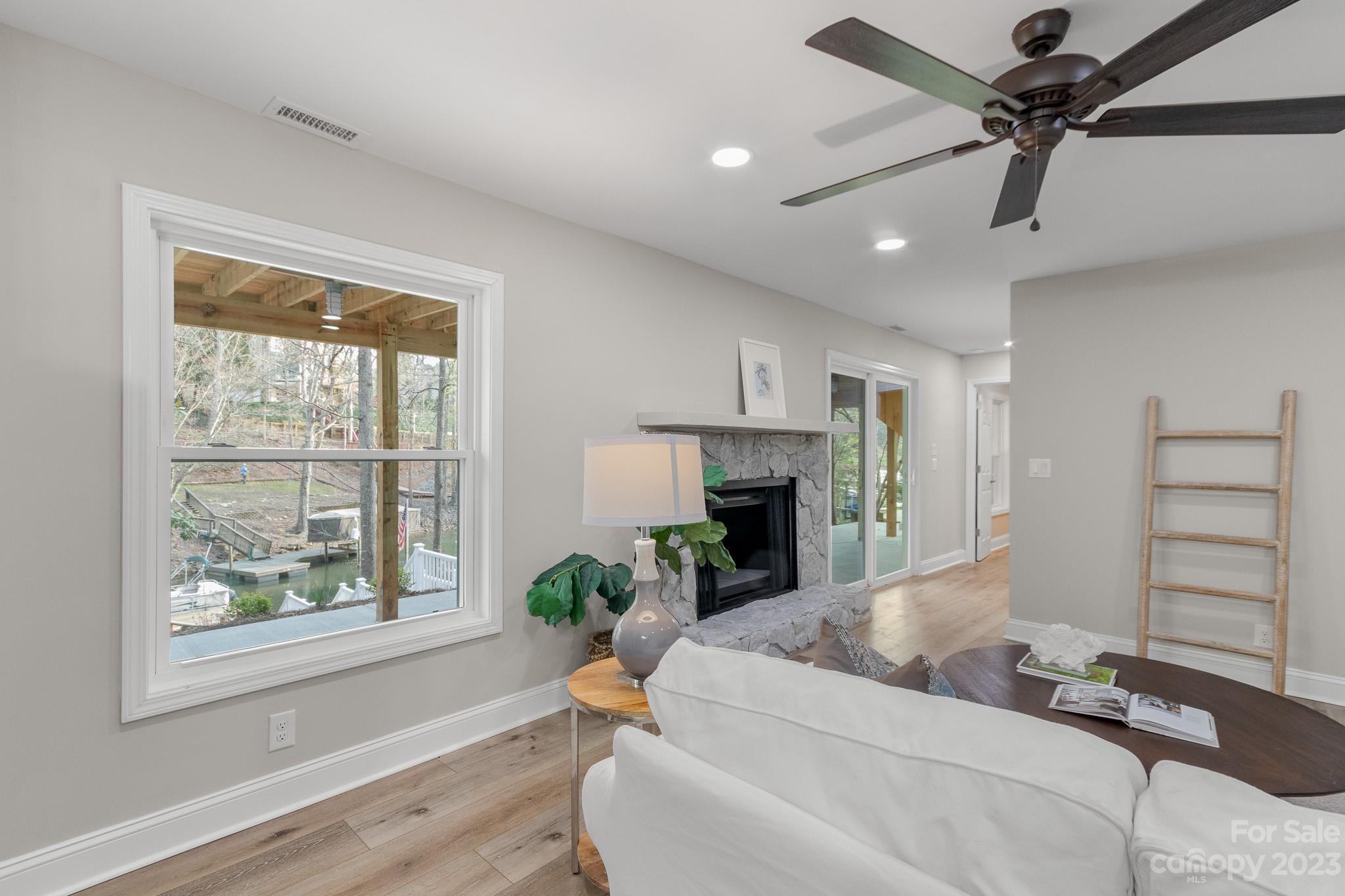 7022 Chelsea Day Lane Tega Cay, SC 29708 - Photo 10 of 48 a living room with furniture and a fireplace