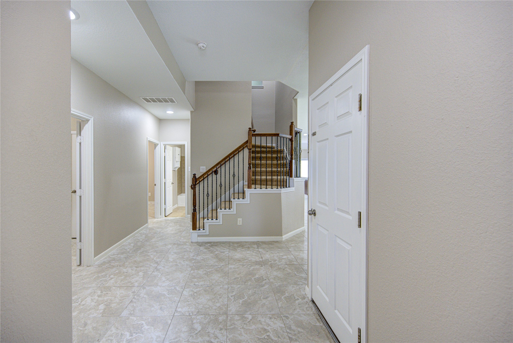 6014 Watford Bend Rosenberg, TX 77471 - Photo 16 of 18 19 – Welcoming entryway with open sightlines and staircase to the second floor.