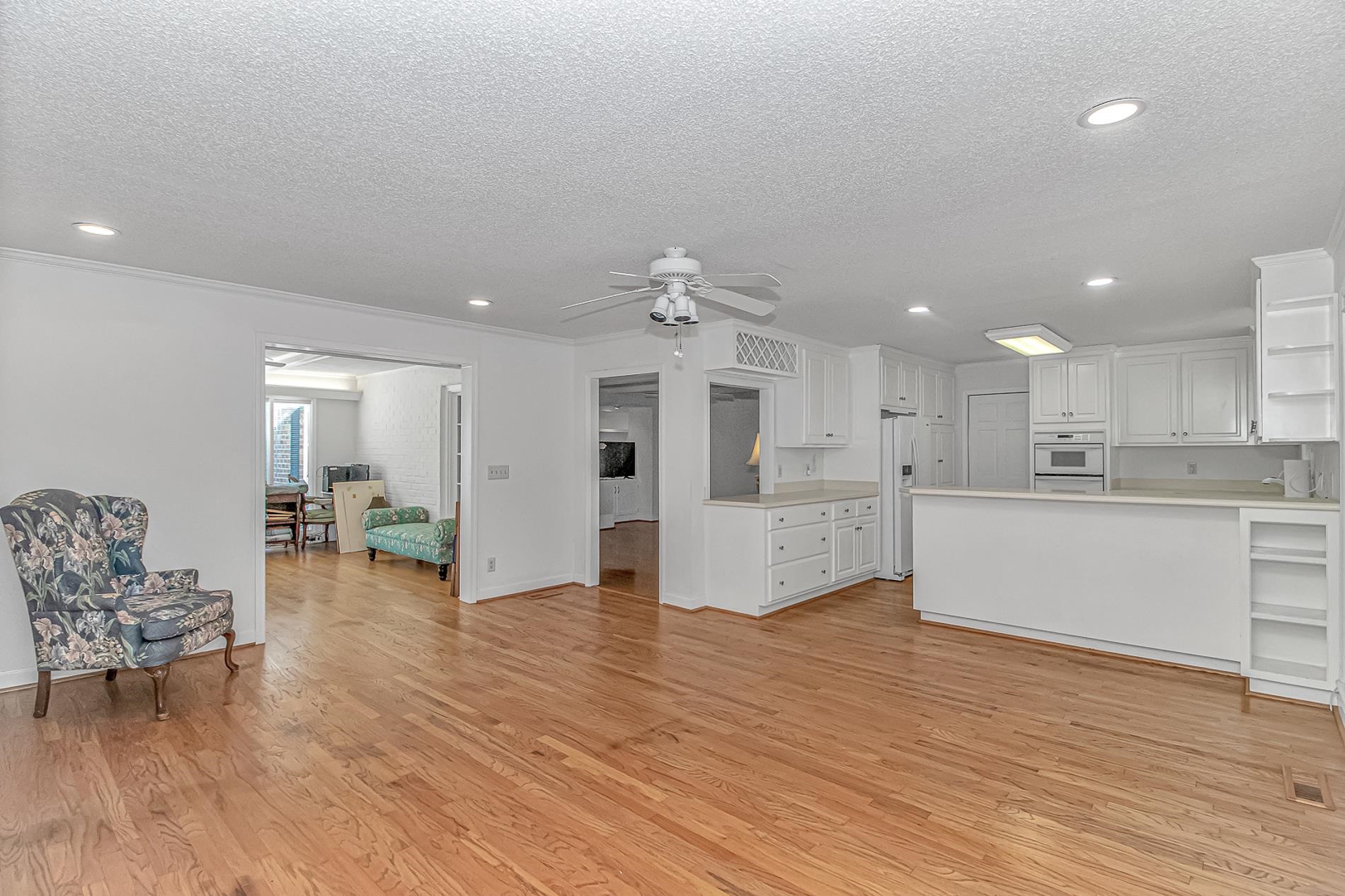 119 University Circle Conway, SC 29526 - Photo 40 of 40 Kitchen featuring open shelves, open floor plan, a peninsula, recessed lighting, and a textured ceiling
