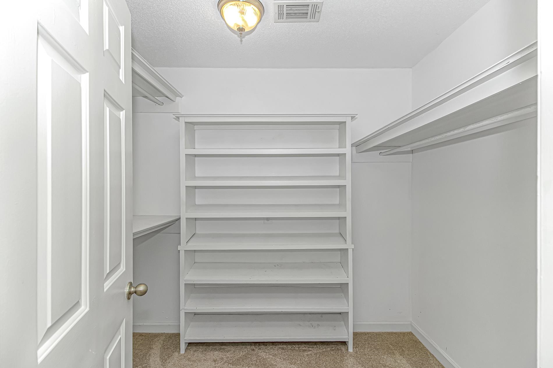 119 University Circle Conway, SC 29526 - Photo 18 of 40 Walk in closet featuring light colored carpet