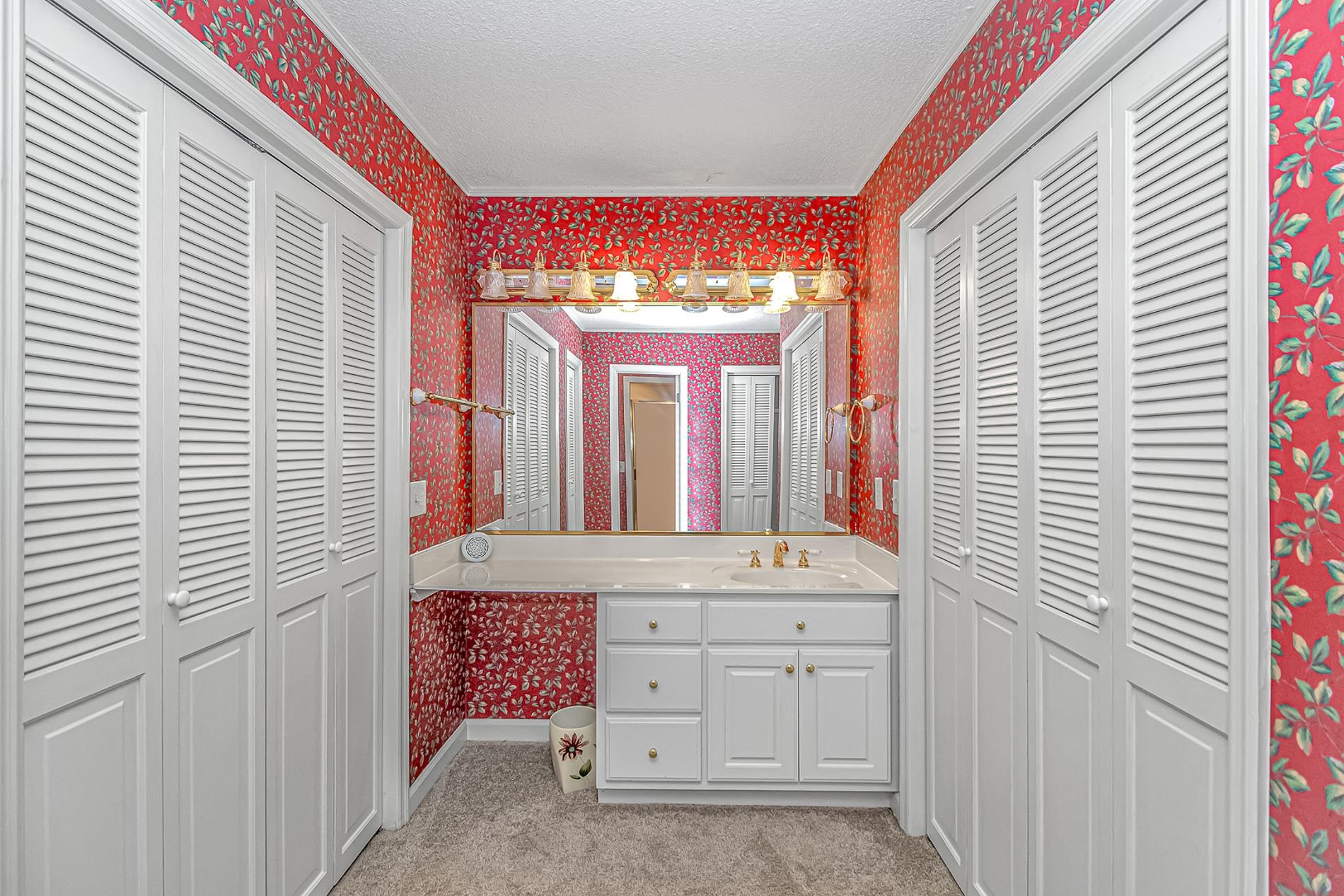 119 University Circle Conway, SC 29526 - Photo 29 of 40 Full bath featuring a closet, wallpapered walls, a textured ceiling, vanity, and light colored carpet