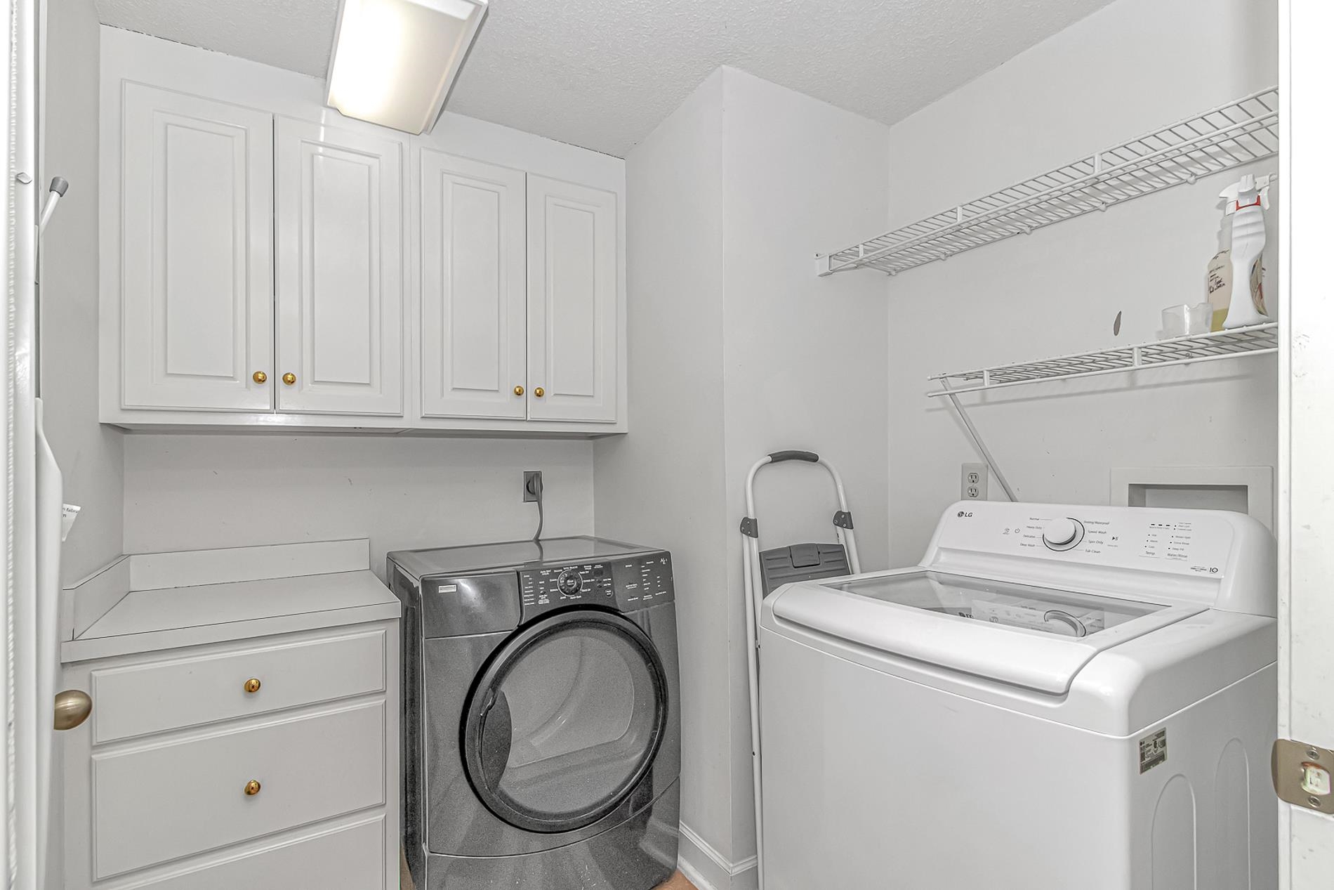 119 University Circle Conway, SC 29526 - Photo 31 of 40 Washroom featuring cabinet space, independent washer and dryer, and a textured ceiling