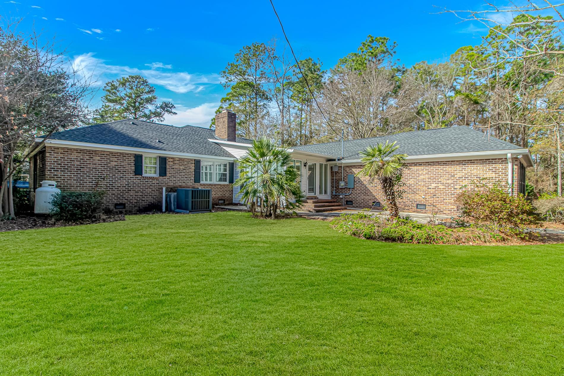 119 University Circle Conway, SC 29526 - Photo 33 of 40 Back of house with crawl space, brick siding, a lawn, and a shingled roof