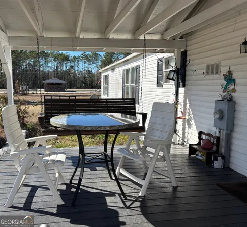 a patio with table and chairs