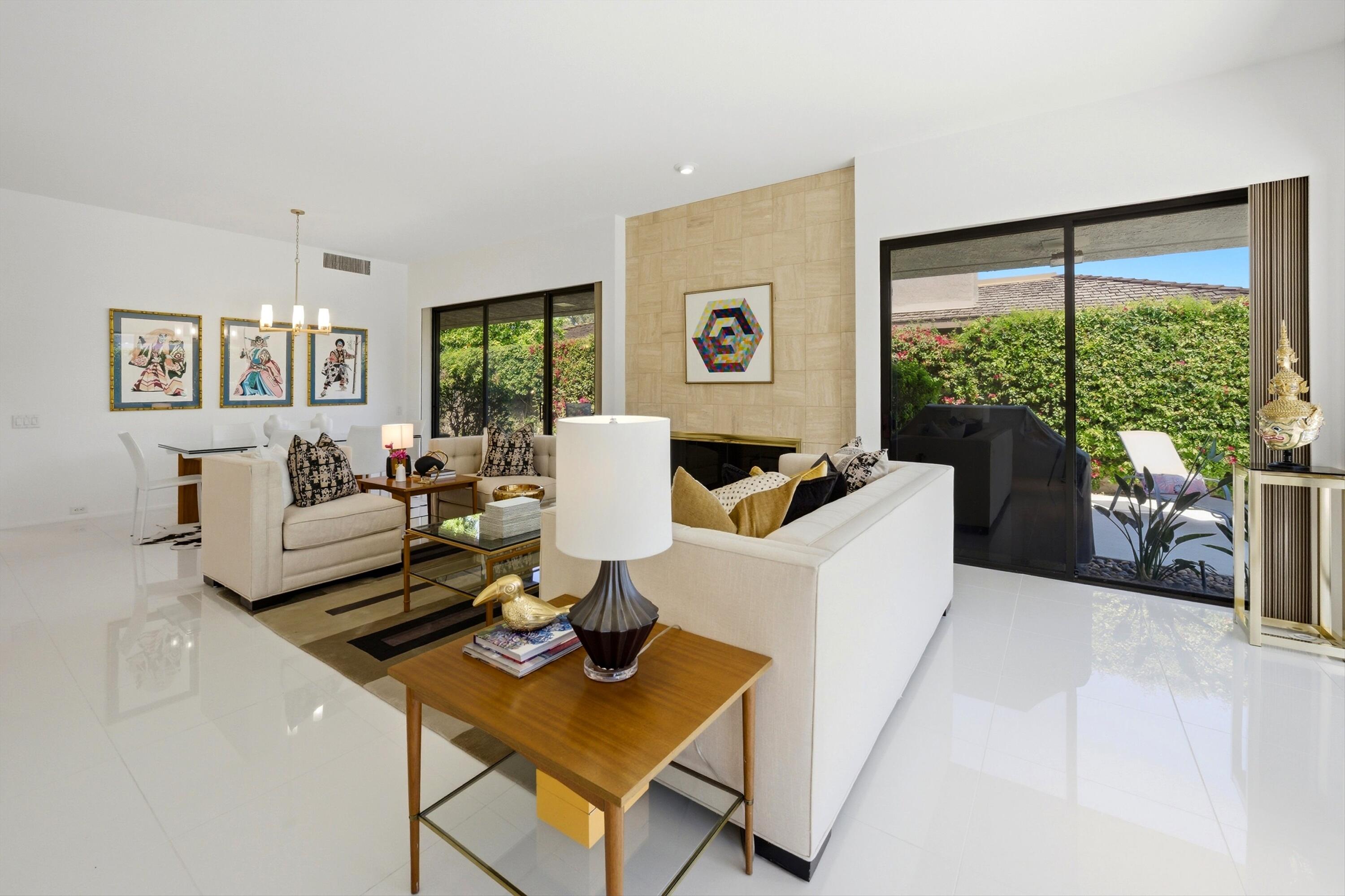 23 Mt Holyoke Drive Rancho Mirage, CA 92270 - Photo 12 of 50 a living room with furniture and a large window