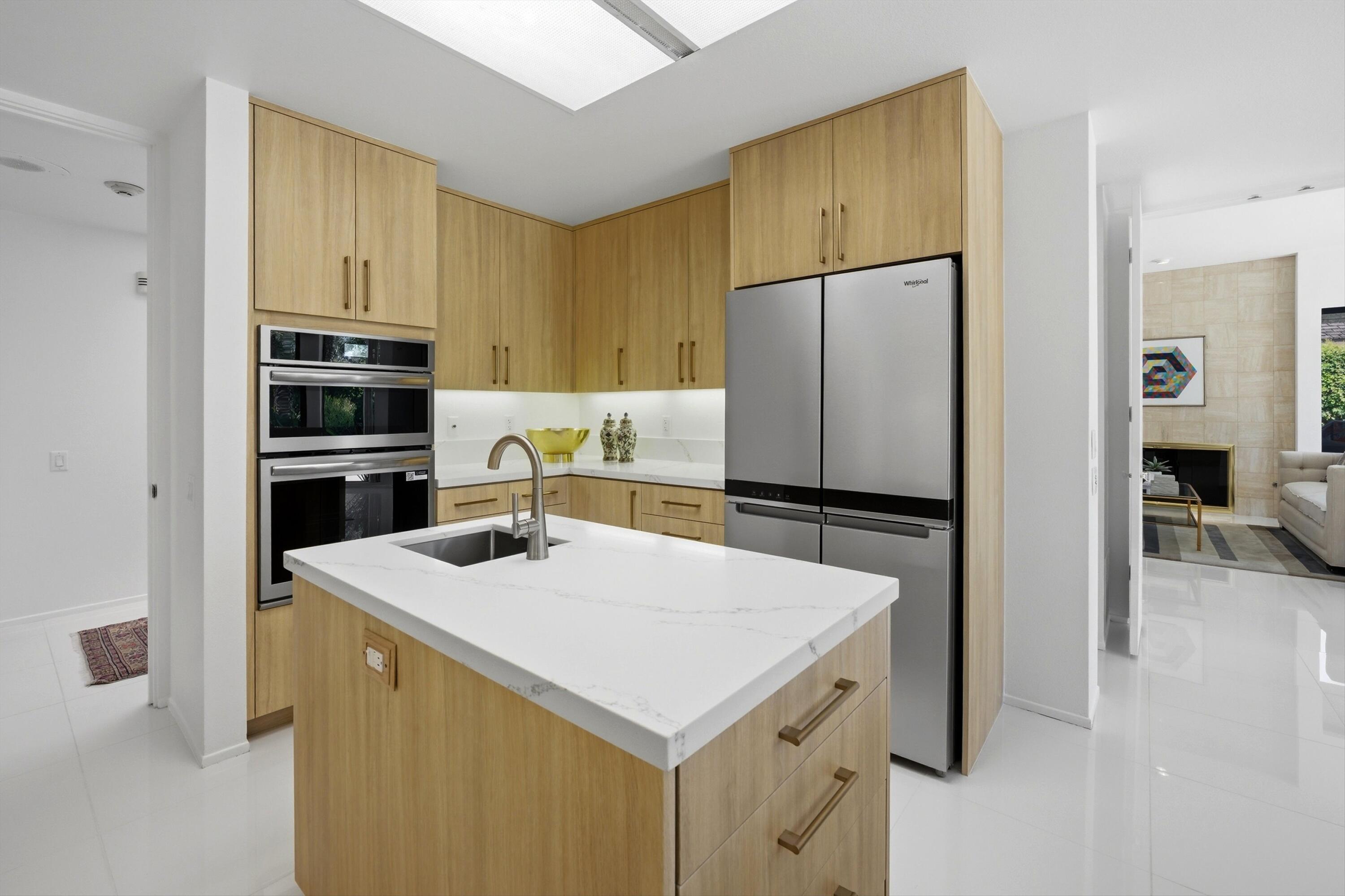 23 Mt Holyoke Drive Rancho Mirage, CA 92270 - Photo 20 of 50 a kitchen that has a cabinets and a refrigerator