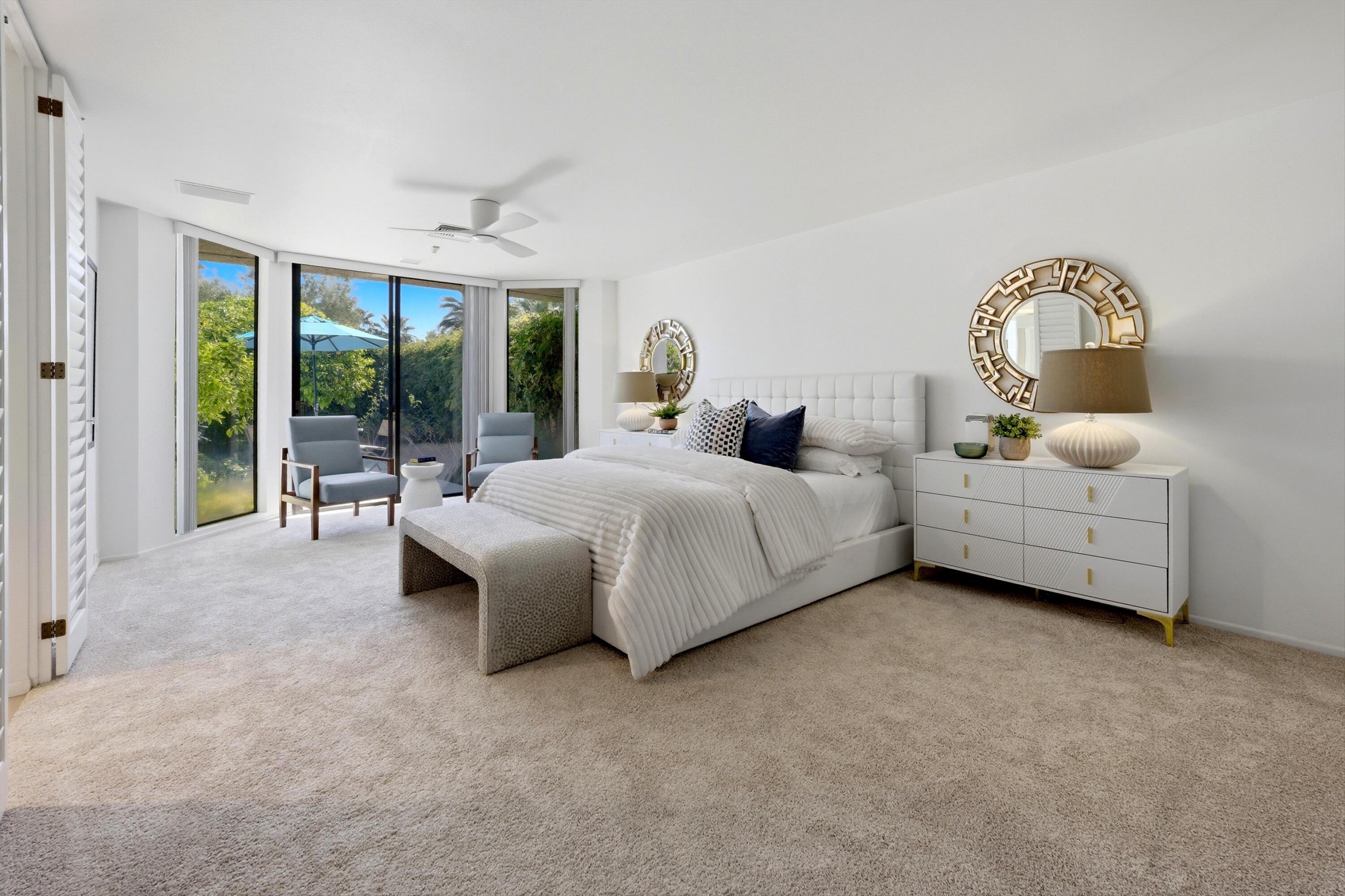 23 Mt Holyoke Drive Rancho Mirage, CA 92270 - Photo 21 of 50 a spacious bedroom with a bed and a large window