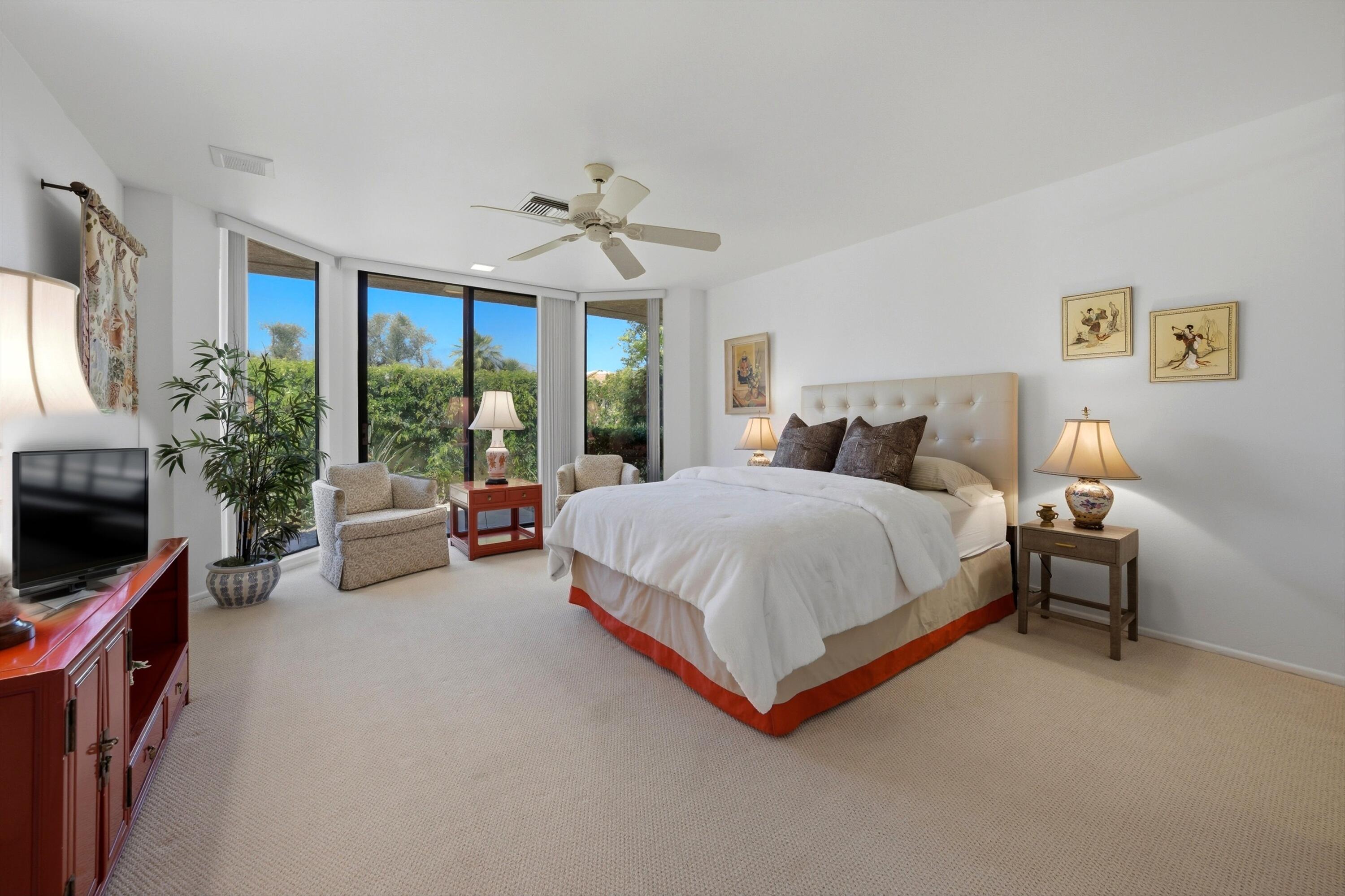 23 Mt Holyoke Drive Rancho Mirage, CA 92270 - Photo 27 of 50 a spacious bedroom with a bed and a couch