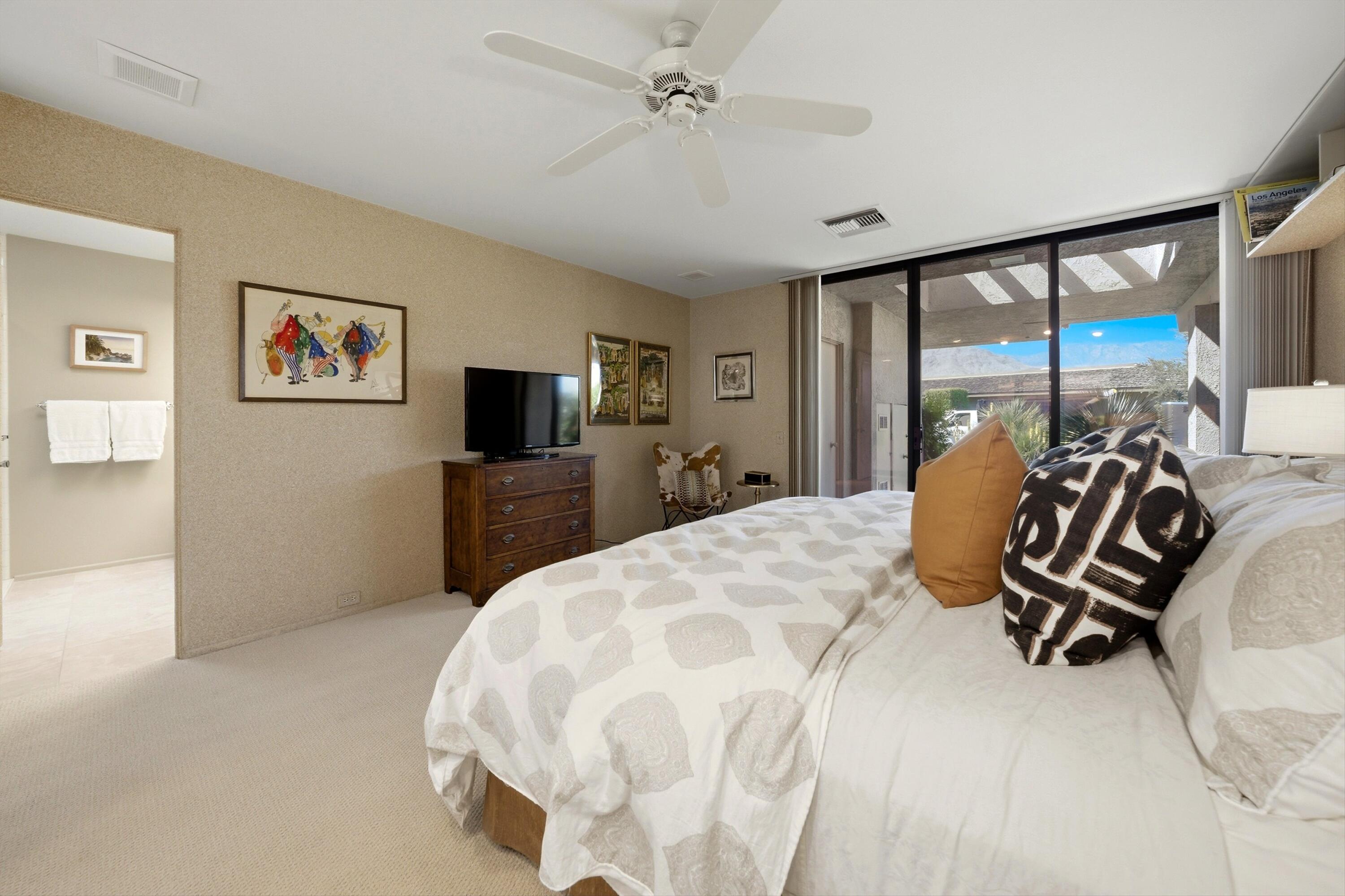 23 Mt Holyoke Drive Rancho Mirage, CA 92270 - Photo 31 of 50 a bedroom with a bed and a flat screen tv
