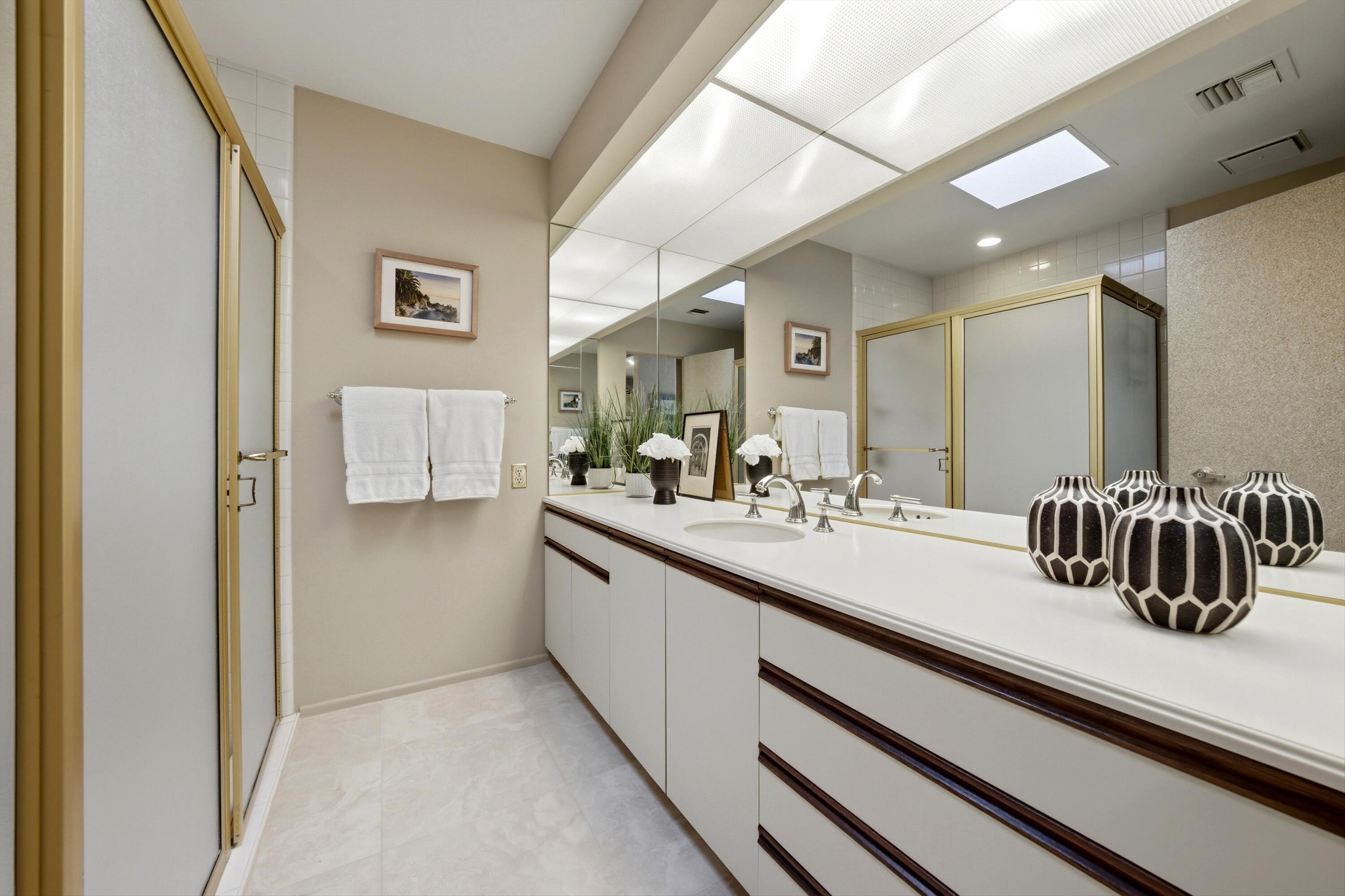 23 Mt Holyoke Drive Rancho Mirage, CA 92270 - Photo 32 of 50 a bathroom with a sink and a mirror