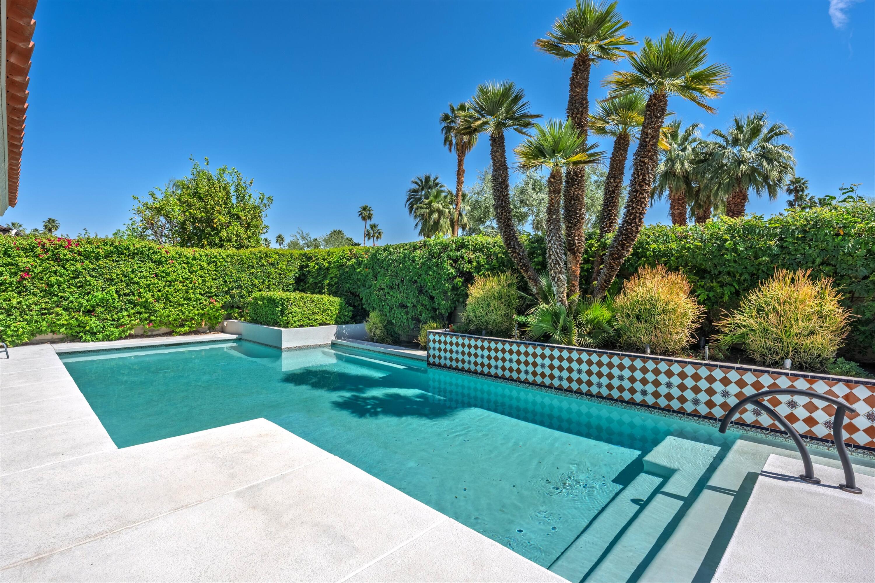 23 Mt Holyoke Drive Rancho Mirage, CA 92270 - Photo 35 of 50 a view of a garden with a bench