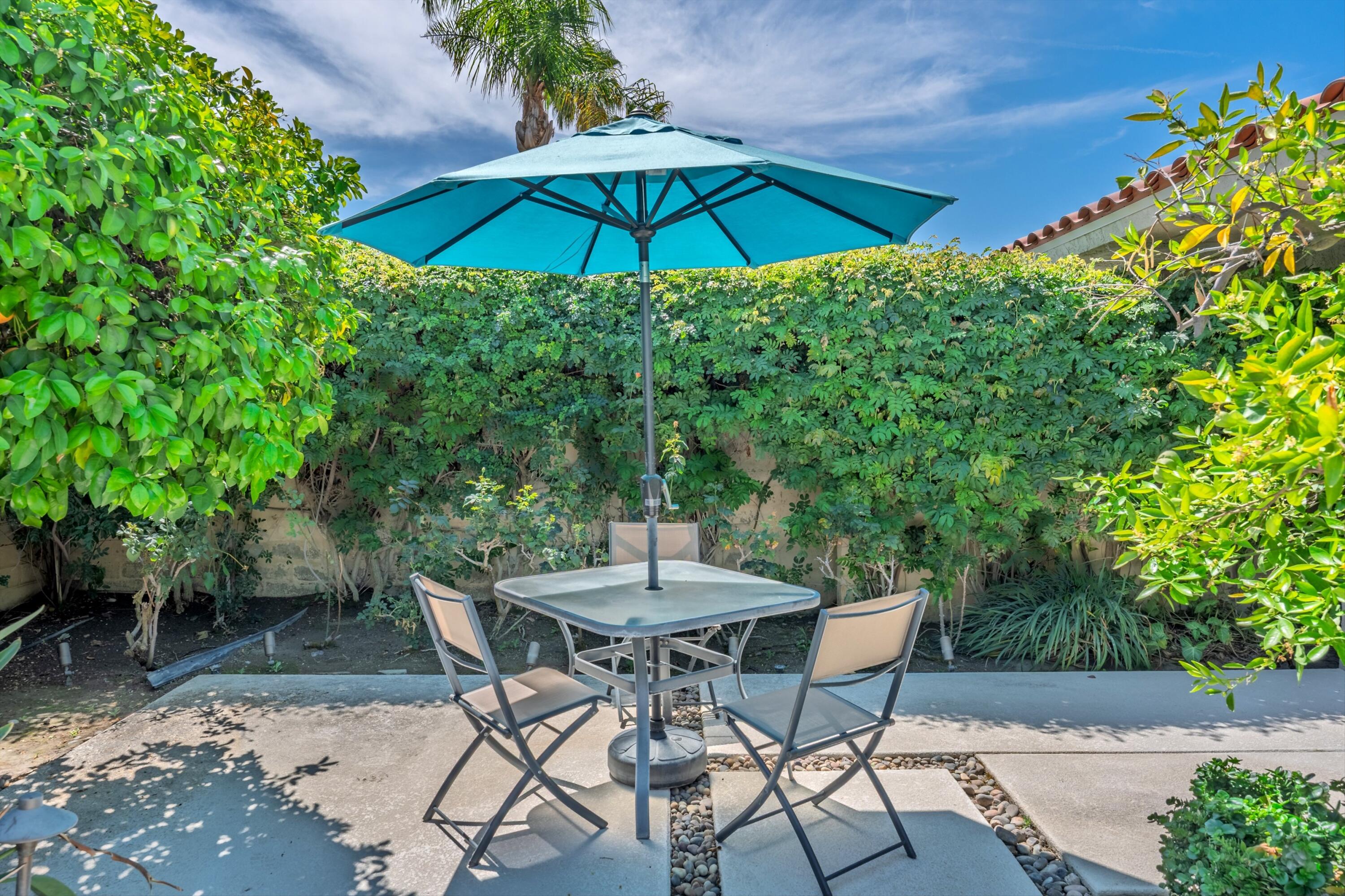 23 Mt Holyoke Drive Rancho Mirage, CA 92270 - Photo 38 of 50 a view of an outdoor sitting area with furniture and a garden