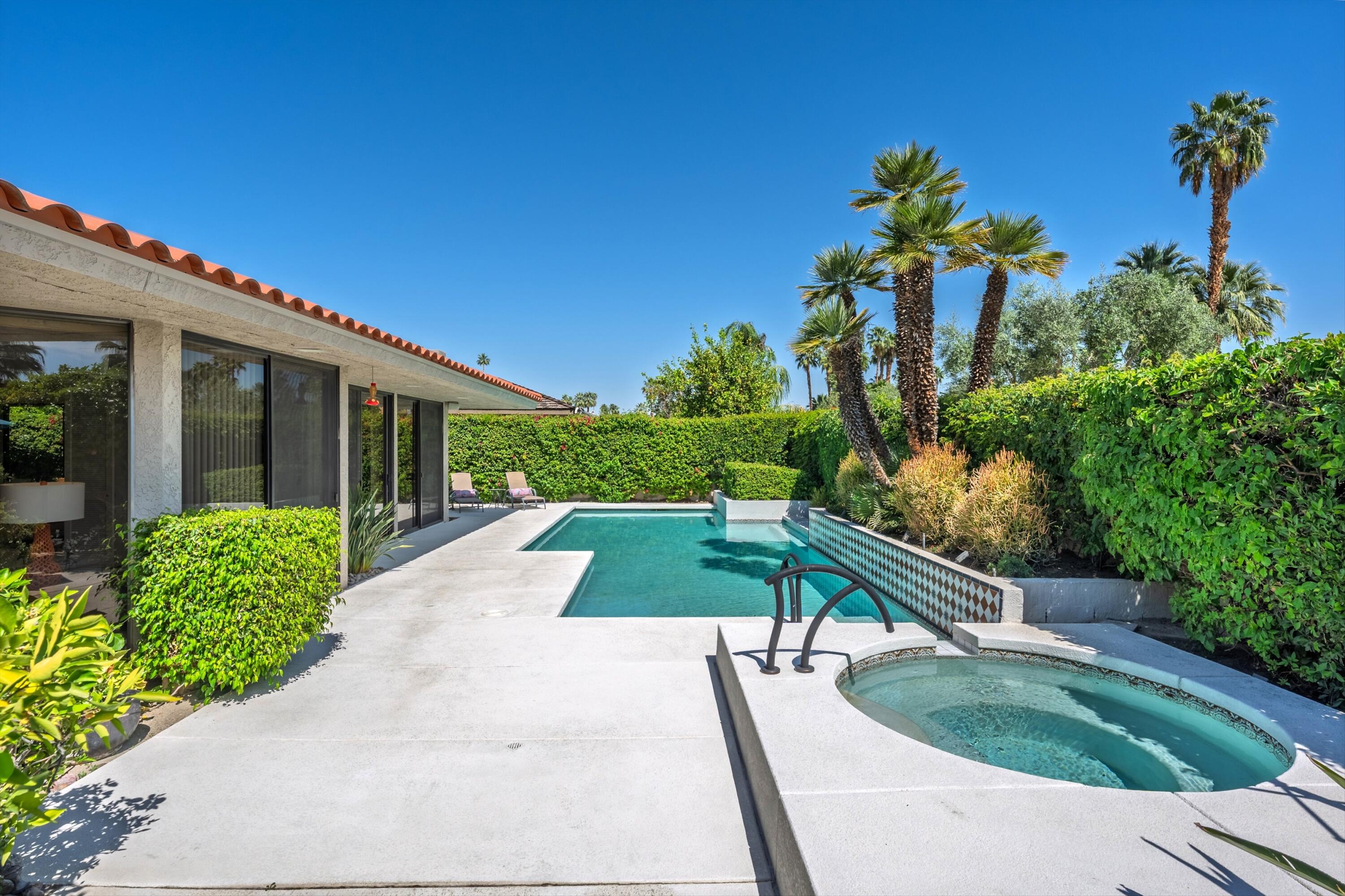 23 Mt Holyoke Drive Rancho Mirage, CA 92270 - Photo 39 of 50 a view of yellow house with a yard