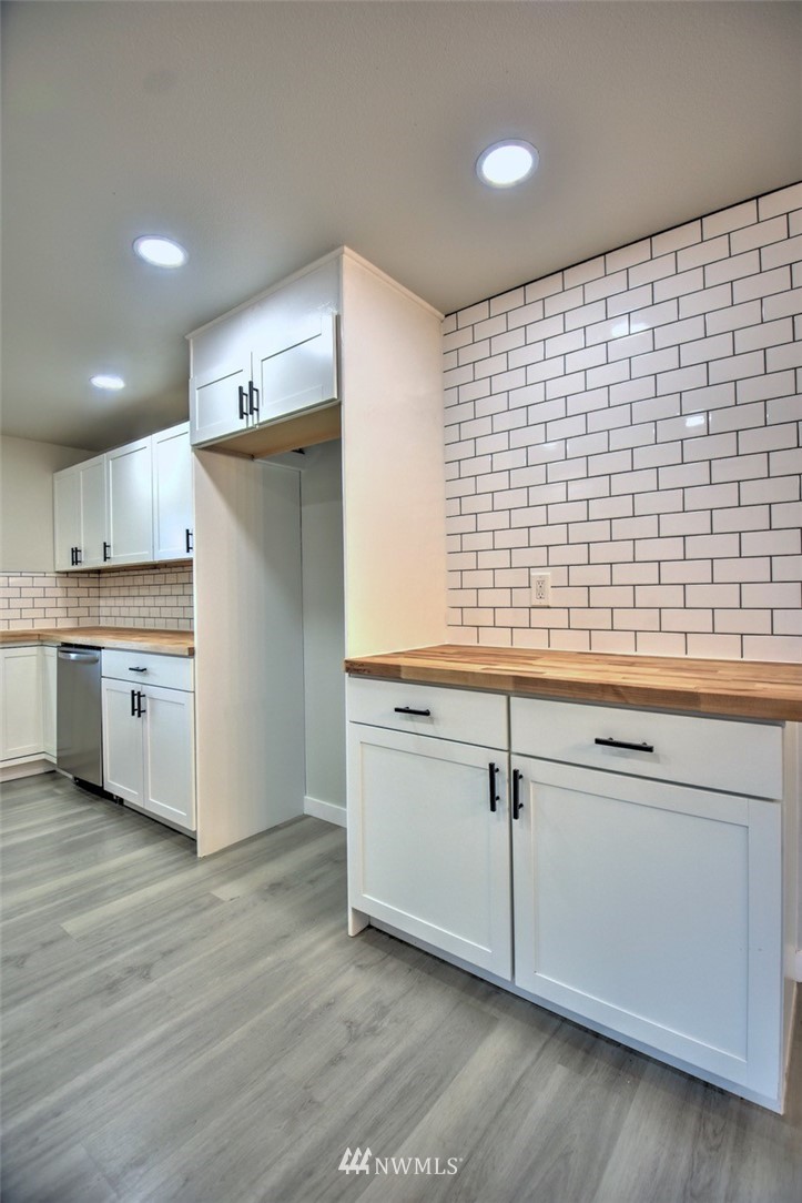 10330 185th Avenue Southwest Rochester, WA 98579 - Photo 14 of 22 a kitchen with a sink cabinets and a window