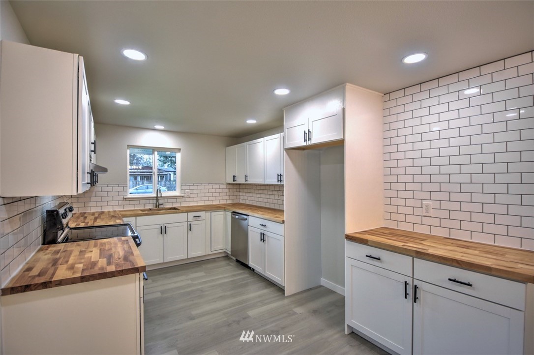 10330 185th Avenue Southwest Rochester, WA 98579 - Photo 9 of 22 a kitchen with refrigerator and sink