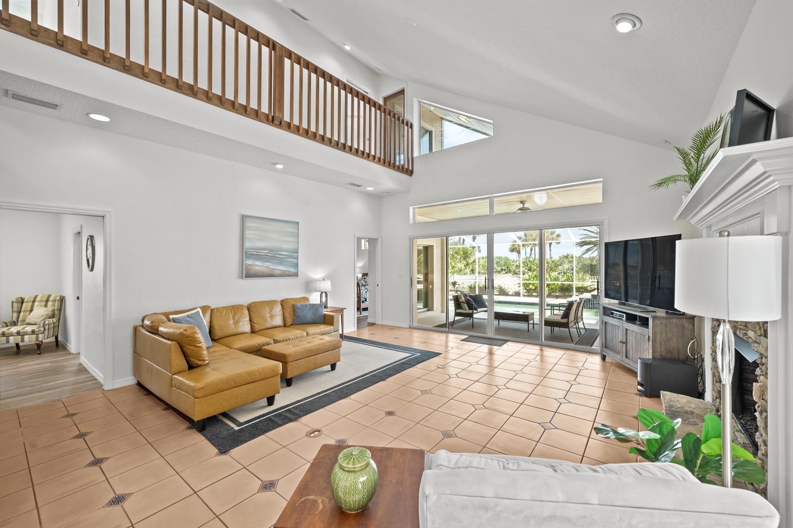 9224 July Lane St. Augustine, FL 32080 - Photo 27 of 88 a living room with patio furniture and a flat screen tv