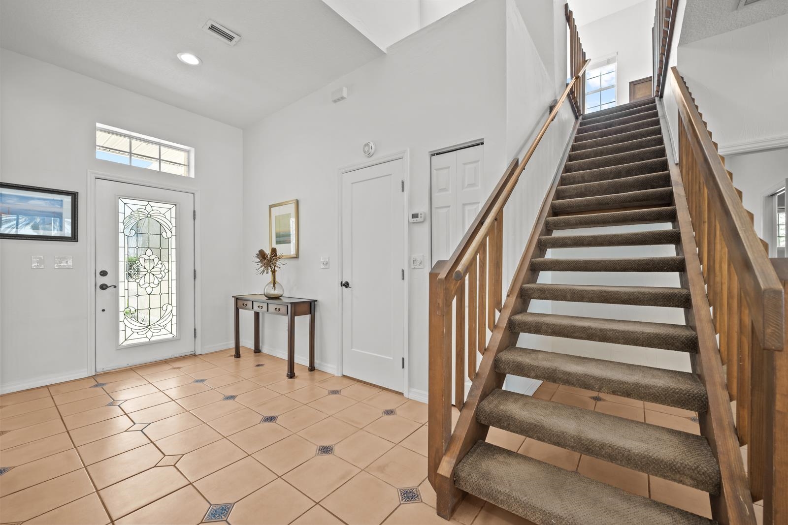 9224 July Lane St. Augustine, FL 32080 - Photo 33 of 88 a view of an entryway with wooden floor and livingroom view