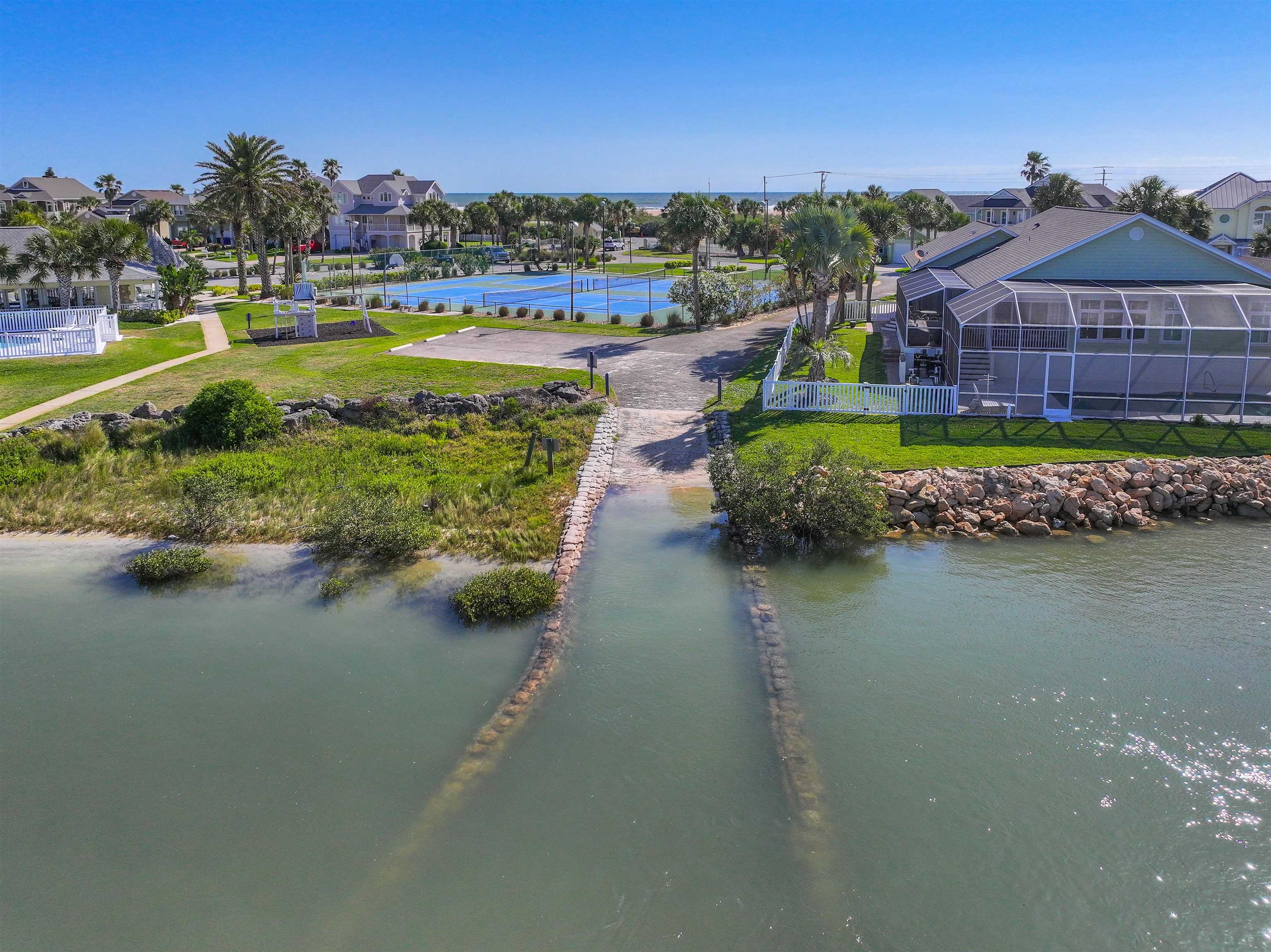 9224 July Lane St. Augustine, FL 32080 - Photo 65 of 88 a view of a lake with a house in the background