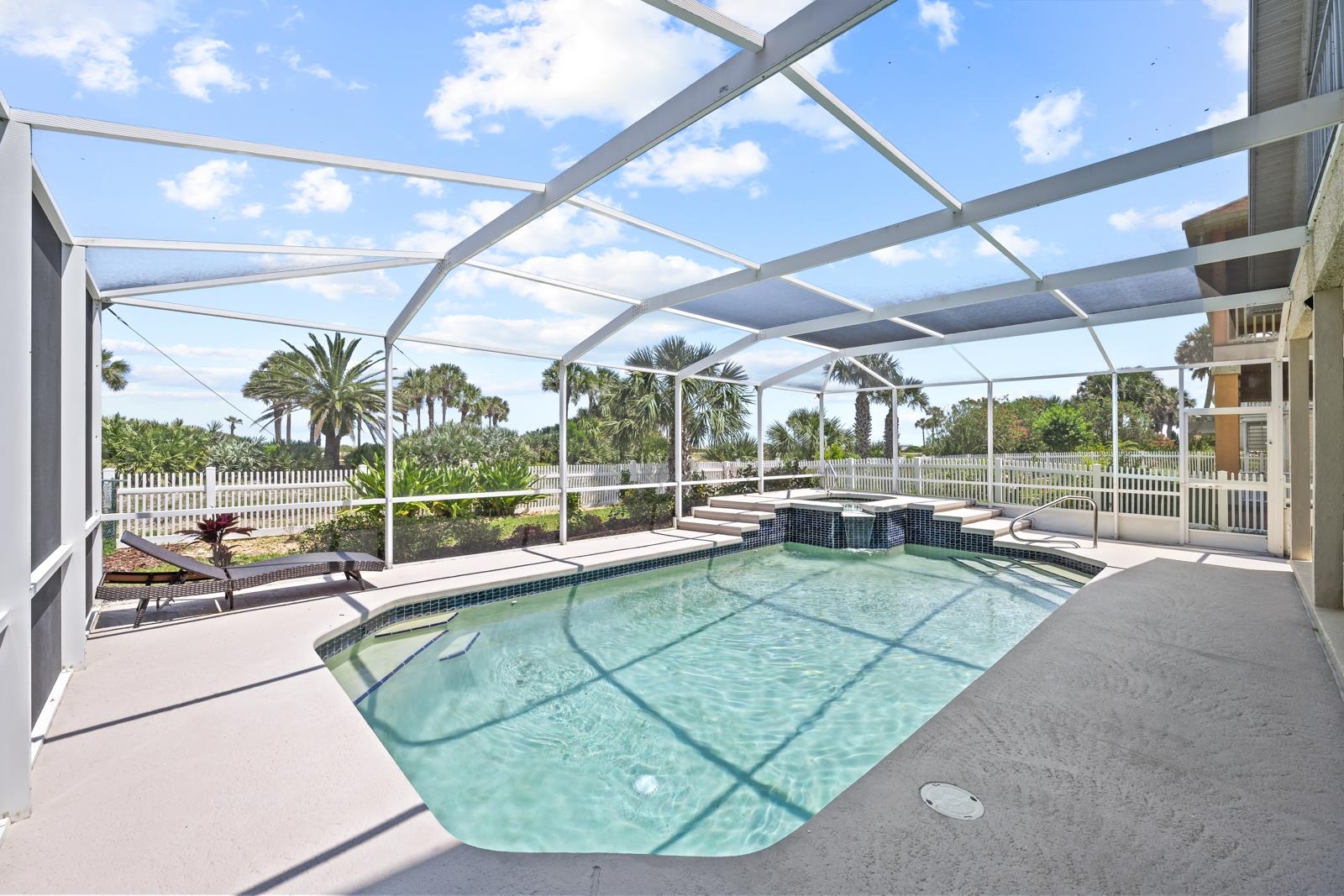 9224 July Lane St. Augustine, FL 32080 - Photo 8 of 88 a view of a swimming pool with a patio