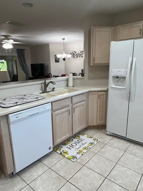 7928 Southwest 80th Pl Road Ocala, FL 34476 - Photo 12 of 30 a kitchen with a sink window and refrigerator