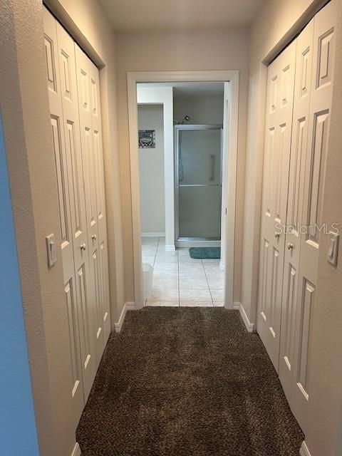 7928 Southwest 80th Pl Road Ocala, FL 34476 - Photo 14 of 30 a view of a hallway with wooden floor and closet area