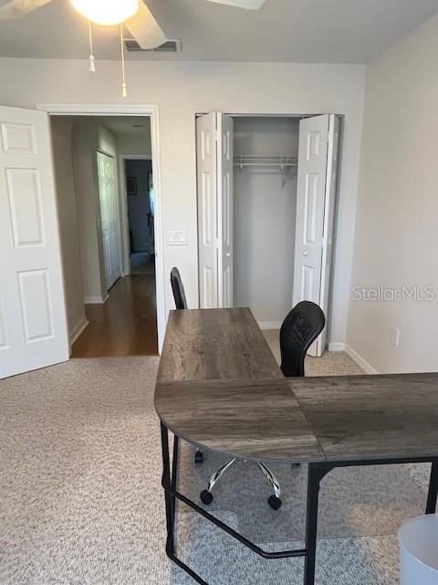 7928 Southwest 80th Pl Road Ocala, FL 34476 - Photo 20 of 30 a living room with a table chairs and a chandelier