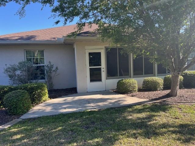 7928 Southwest 80th Pl Road Ocala, FL 34476 - Photo 27 of 30 a view of a backyard with potted plants and large tree