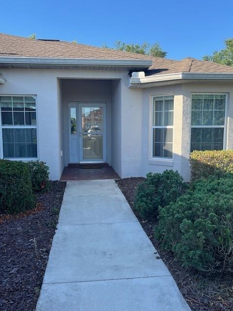 7928 Southwest 80th Pl Road Ocala, FL 34476 - Photo 3 of 30 a front view of a house with a yard