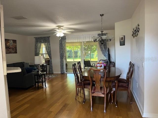 7928 Southwest 80th Pl Road Ocala, FL 34476 - Photo 5 of 30 a view of a dining room with furniture window and wooden floor