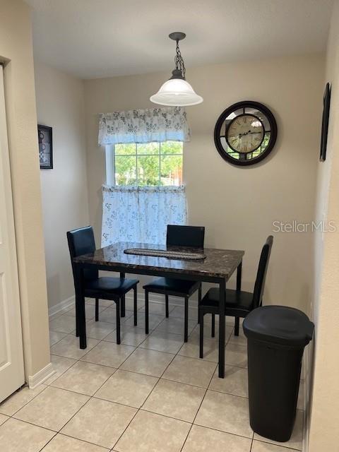 7928 Southwest 80th Pl Road Ocala, FL 34476 - Photo 7 of 30 a view of a dining room with furniture and chandelier