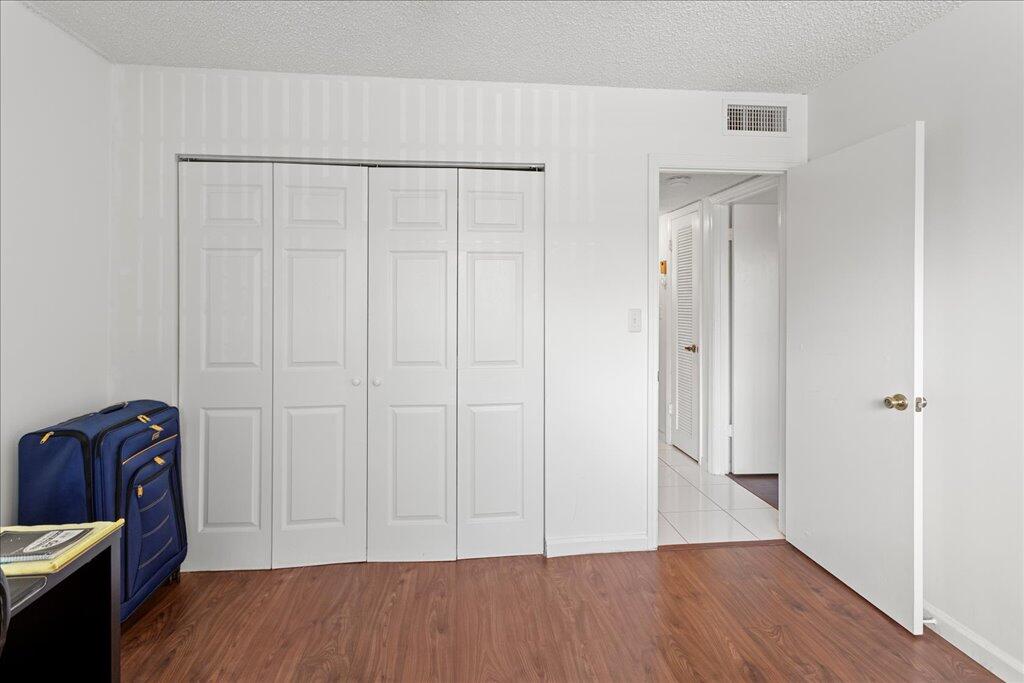 1124 Northwest 13th Street, Unit 120A Boca Raton, FL 33486 - Photo 13 of 23 a view of room with hardwood floor