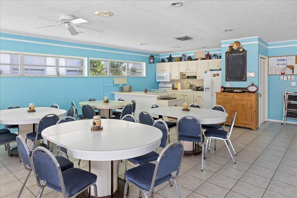 1124 Northwest 13th Street, Unit 120A Boca Raton, FL 33486 - Photo 20 of 23 a view of a dining room with furniture