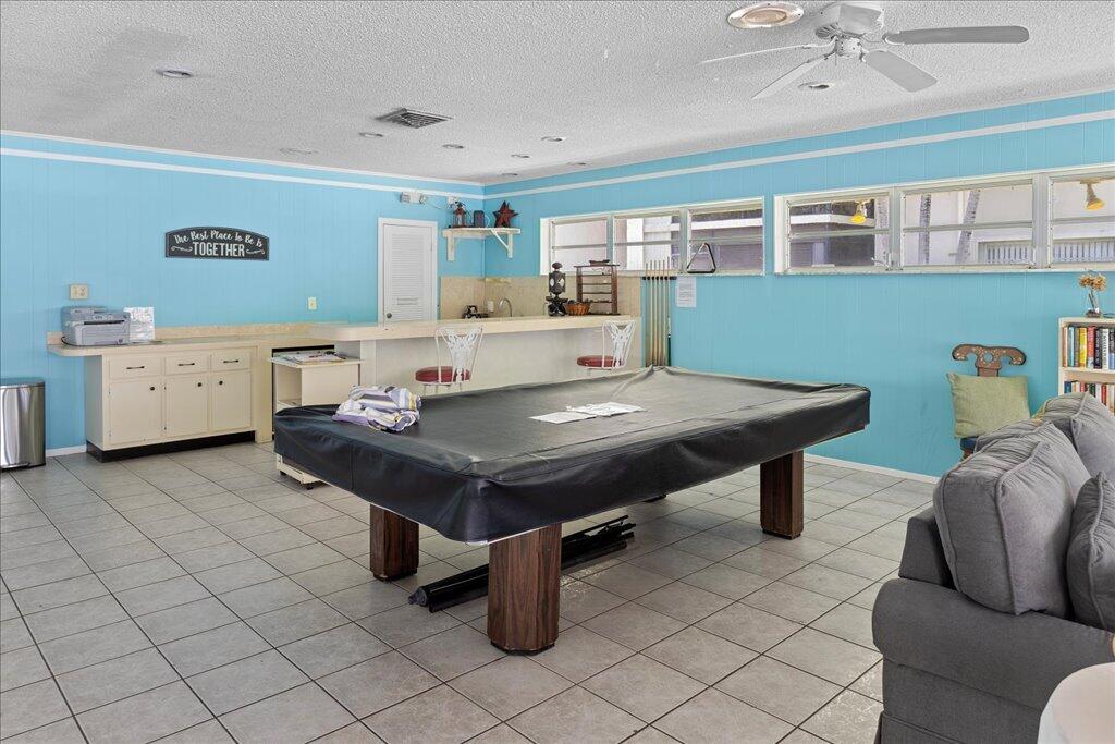1124 Northwest 13th Street, Unit 120A Boca Raton, FL 33486 - Photo 21 of 23 a room with furniture pool table and window