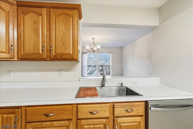 a kitchen with a sink cabinets and window