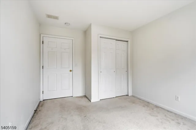 an empty room with closet area