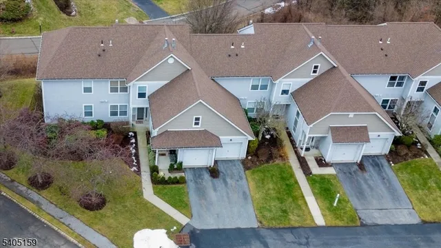 an aerial view of house with yard