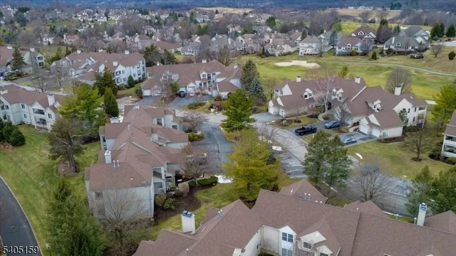 an aerial view of a house with a swimming pool yard and outdoor seating