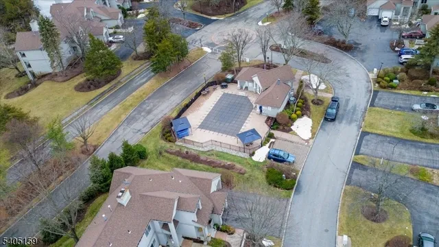 an aerial view of house with a yard