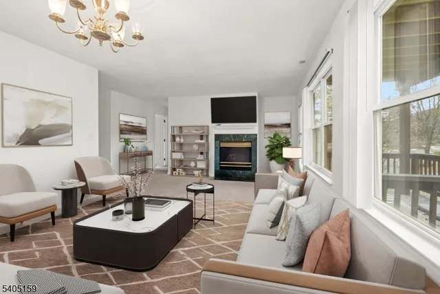 a living room with fireplace furniture and a flat screen tv