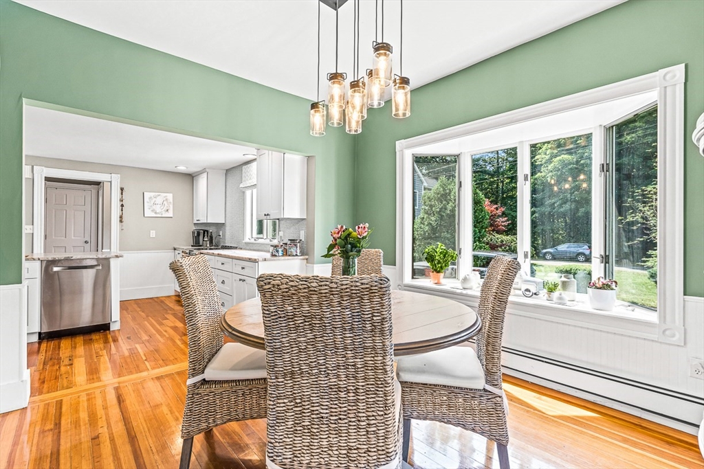 69 Maple Street Middleton, MA 01949 - Photo 14 of 33 a living room with fireplace furniture and a chandelier