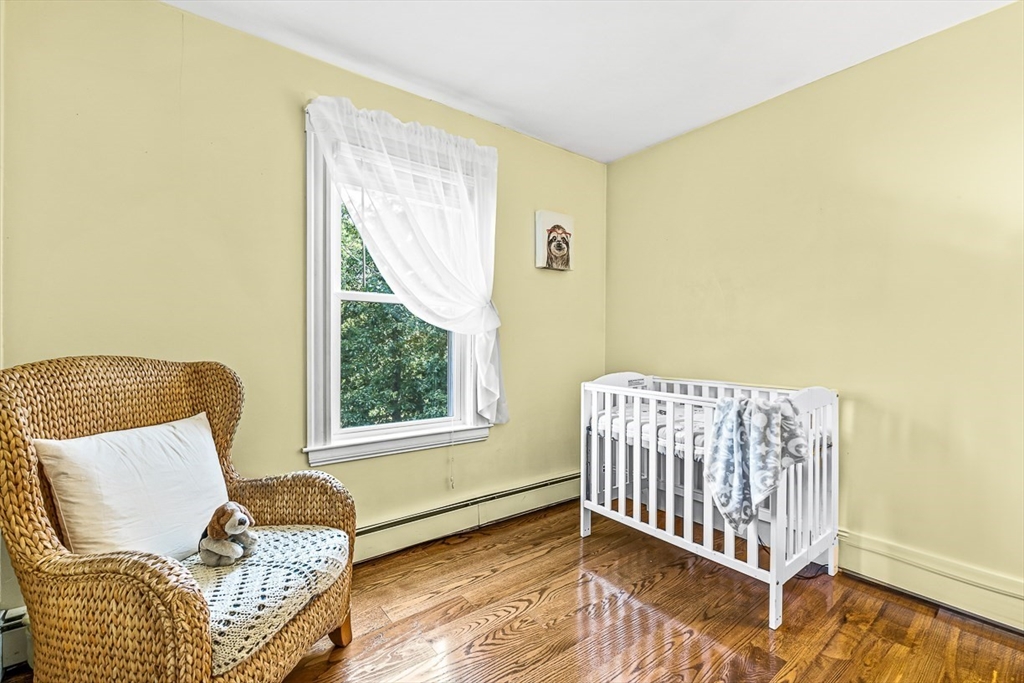 69 Maple Street Middleton, MA 01949 - Photo 18 of 33 a living room with a couch and a window