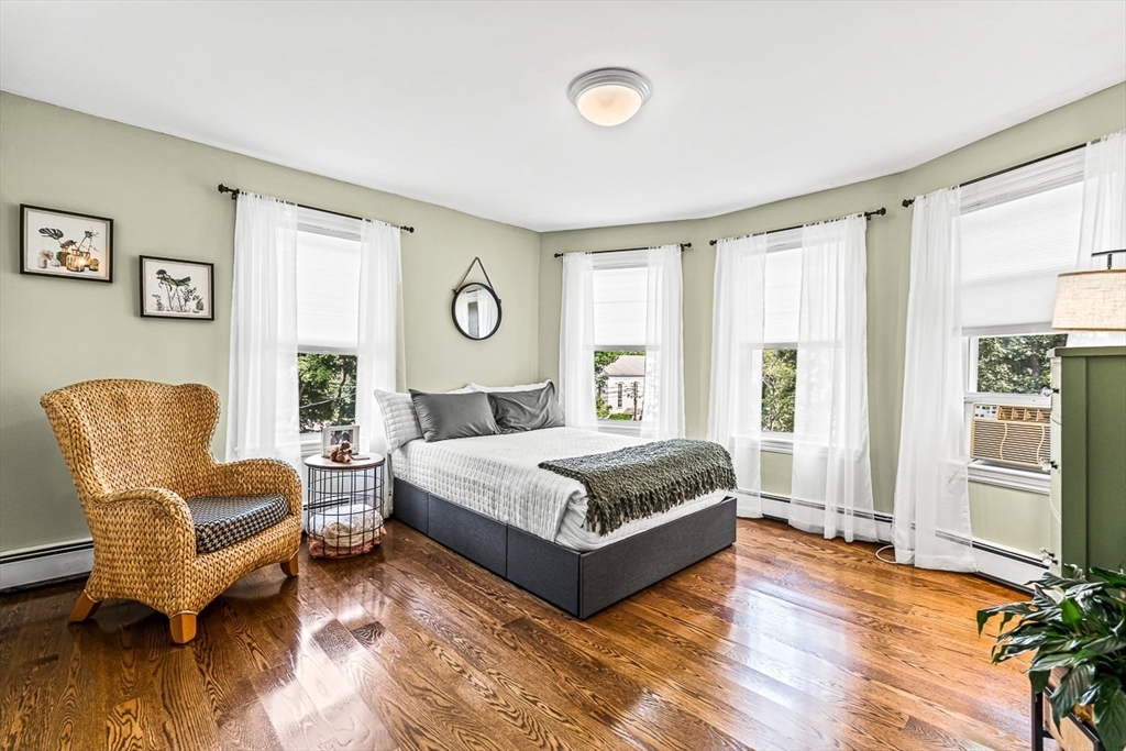 69 Maple Street Middleton, MA 01949 - Photo 20 of 33 a spacious bedroom with a bed and a couch