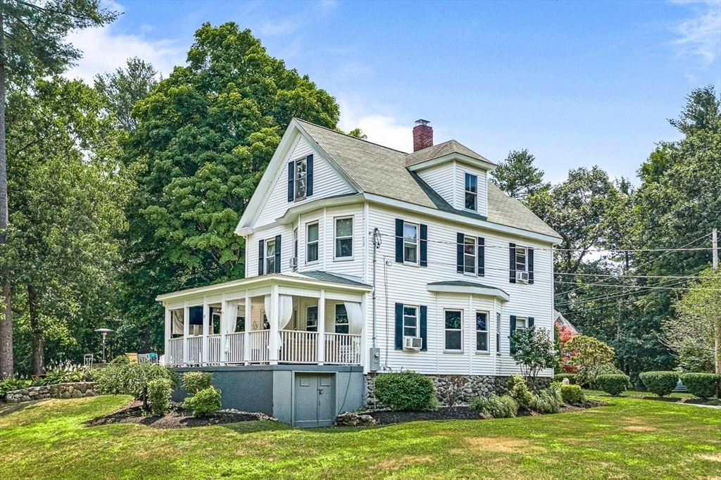 69 Maple Street Middleton, MA 01949 - Photo 2 of 33 a front view of a house with a yard