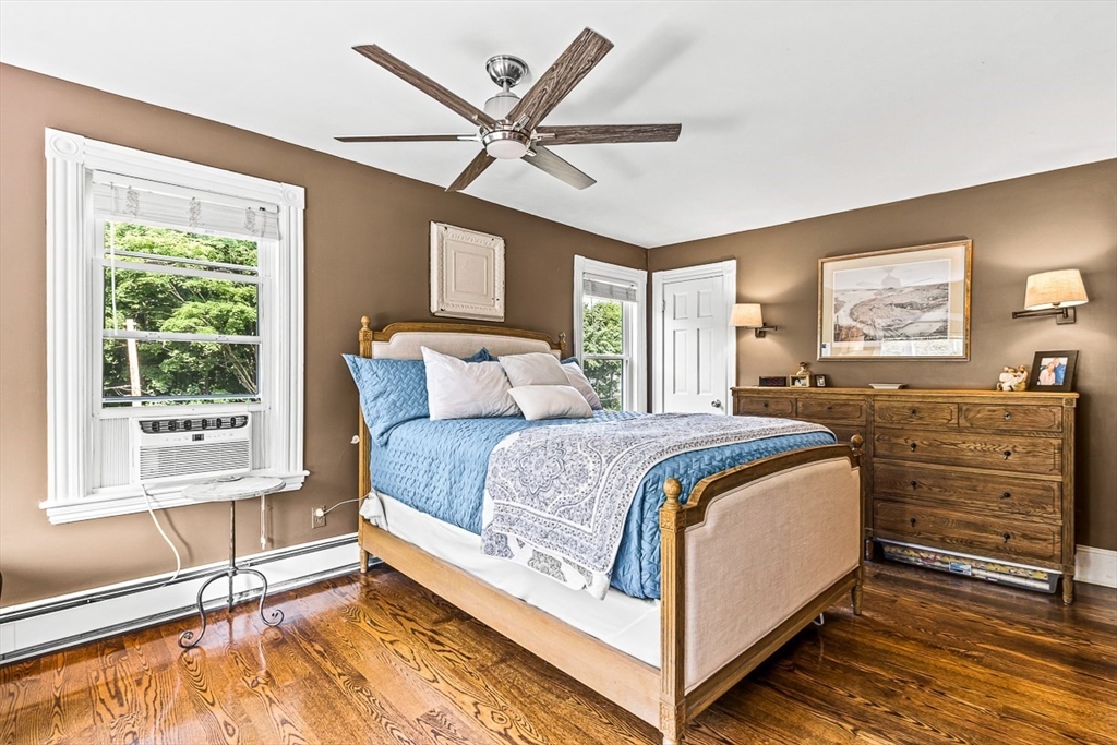 69 Maple Street Middleton, MA 01949 - Photo 22 of 33 a spacious bedroom with a bed and a large window