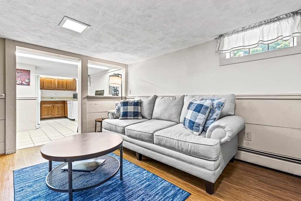 69 Maple Street Middleton, MA 01949 - Photo 24 of 33 a living room with furniture and a table