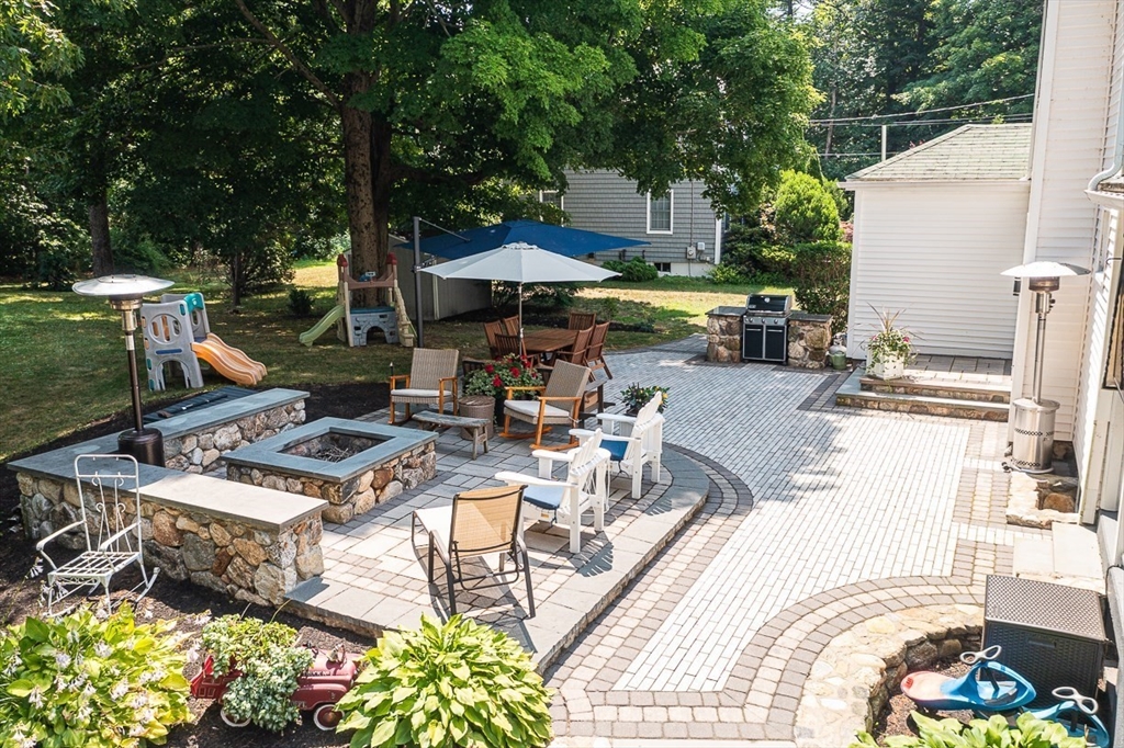 69 Maple Street Middleton, MA 01949 - Photo 28 of 33 a view of a dinning table and chairs in the patio