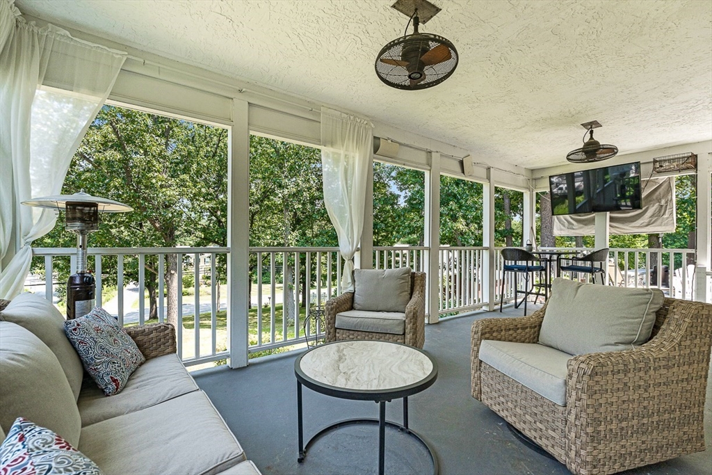 69 Maple Street Middleton, MA 01949 - Photo 32 of 33 a living room with furniture and a floor to ceiling window