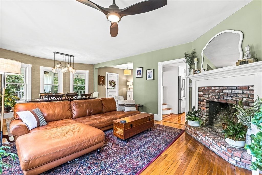 69 Maple Street Middleton, MA 01949 - Photo 9 of 33 a living room with furniture and a fireplace